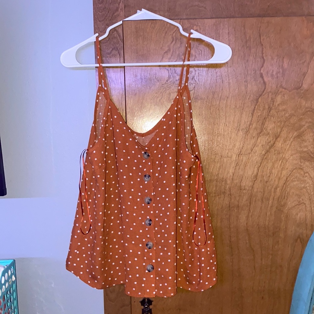 orange and white polka dot tank top